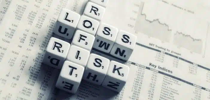 dices over newspaper, profit, loss risk