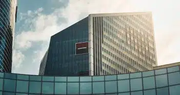 gray concrete building under white clouds during daytime