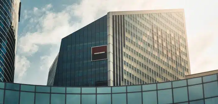 gray concrete building under white clouds during daytime