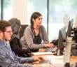 unknown persons using computer indoors