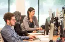 unknown persons using computer indoors