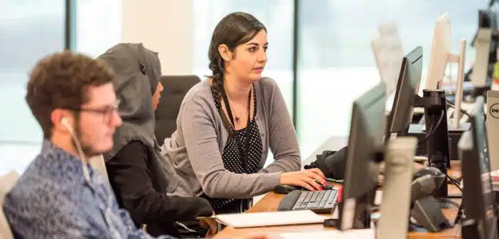 unknown persons using computer indoors